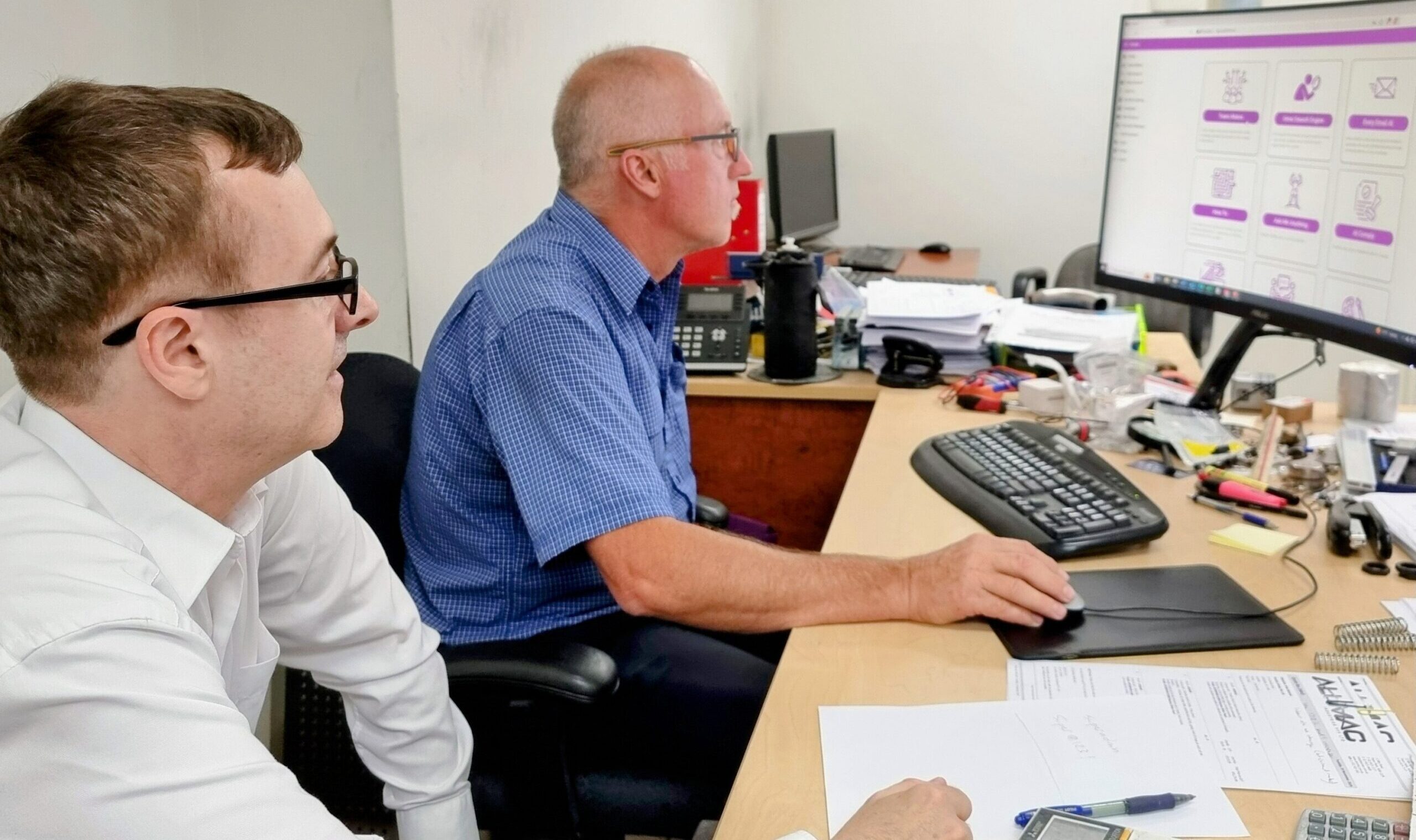 Plug-and-Play Simplicity: Greg Wallis (right) and Peter Carr (left) set up Omnisenti’s SmartAsk AI at Alumac’s Head Office in just 5 minutes—private, on-premises AI made effortless.
